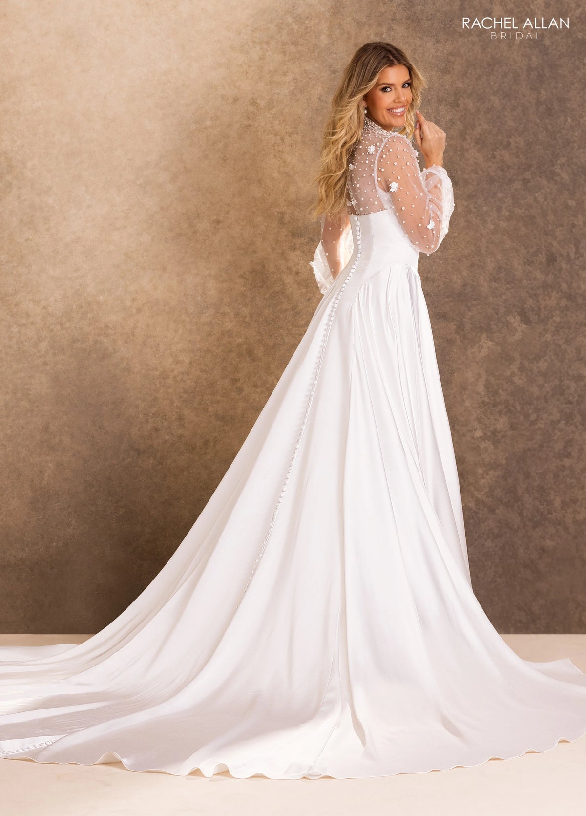 35048-Soft and graceful, this ivory A-line gown