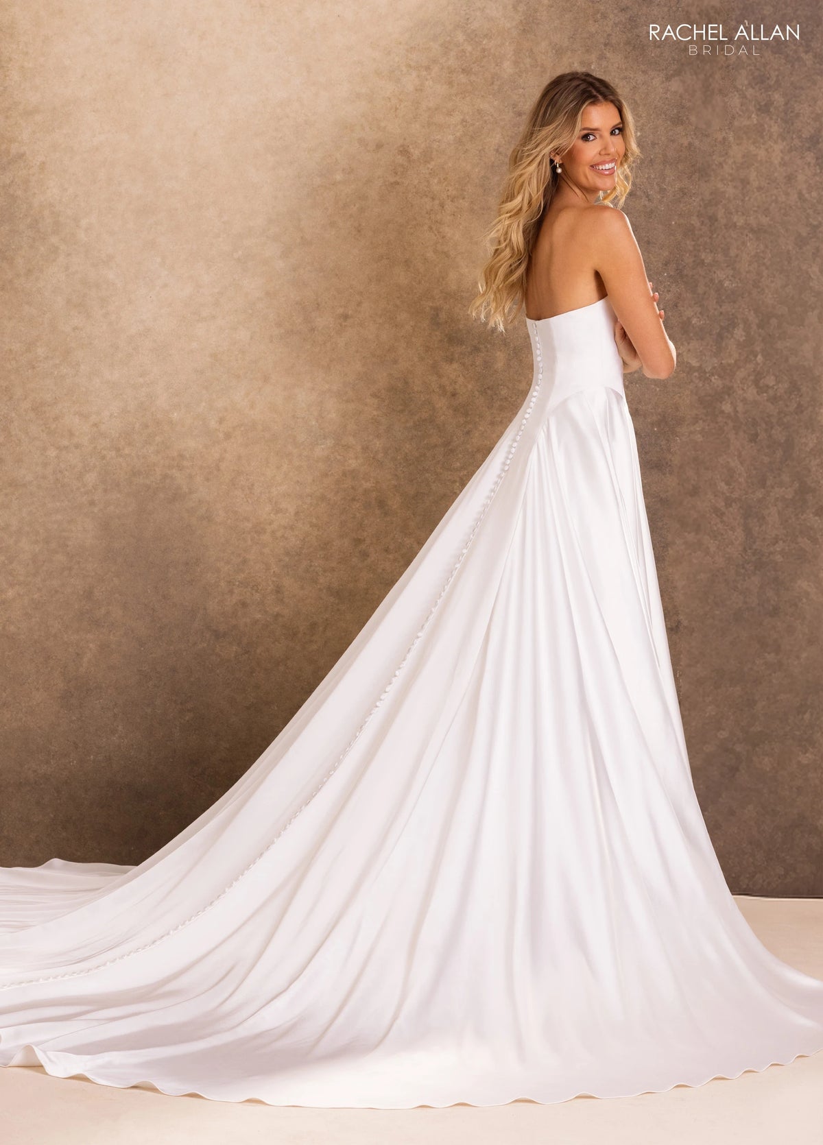 35048-Soft and graceful, this ivory A-line gown