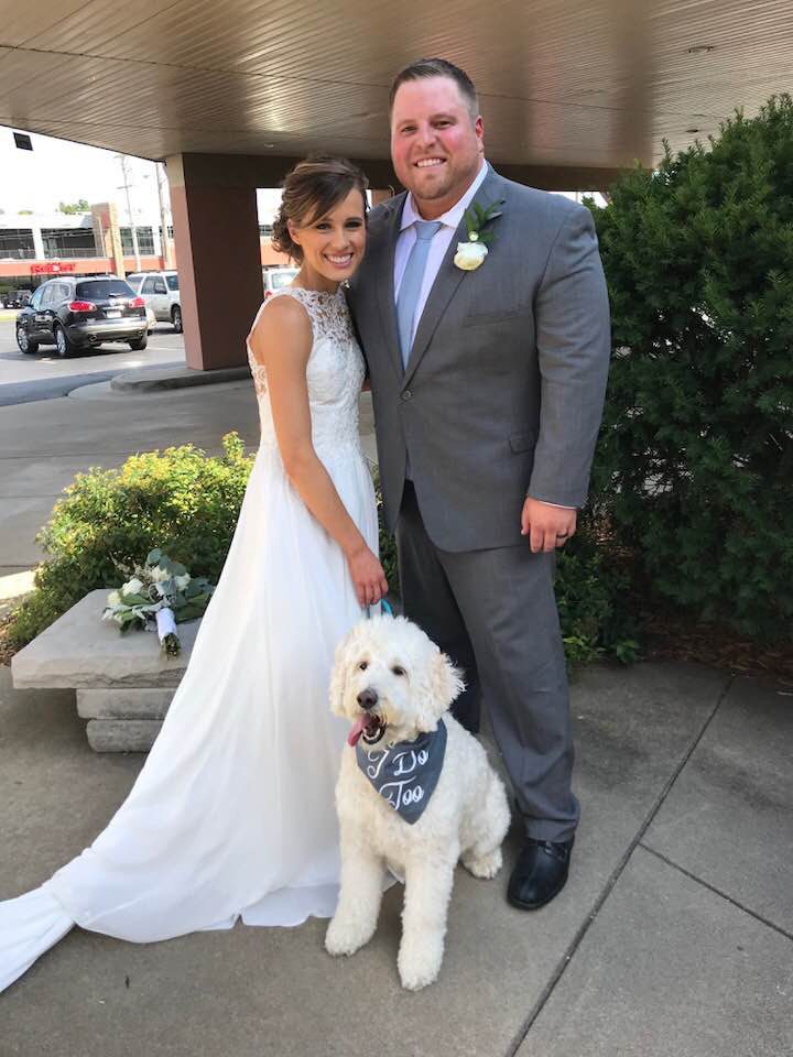 A Norman's bride, her groom, and their dog.