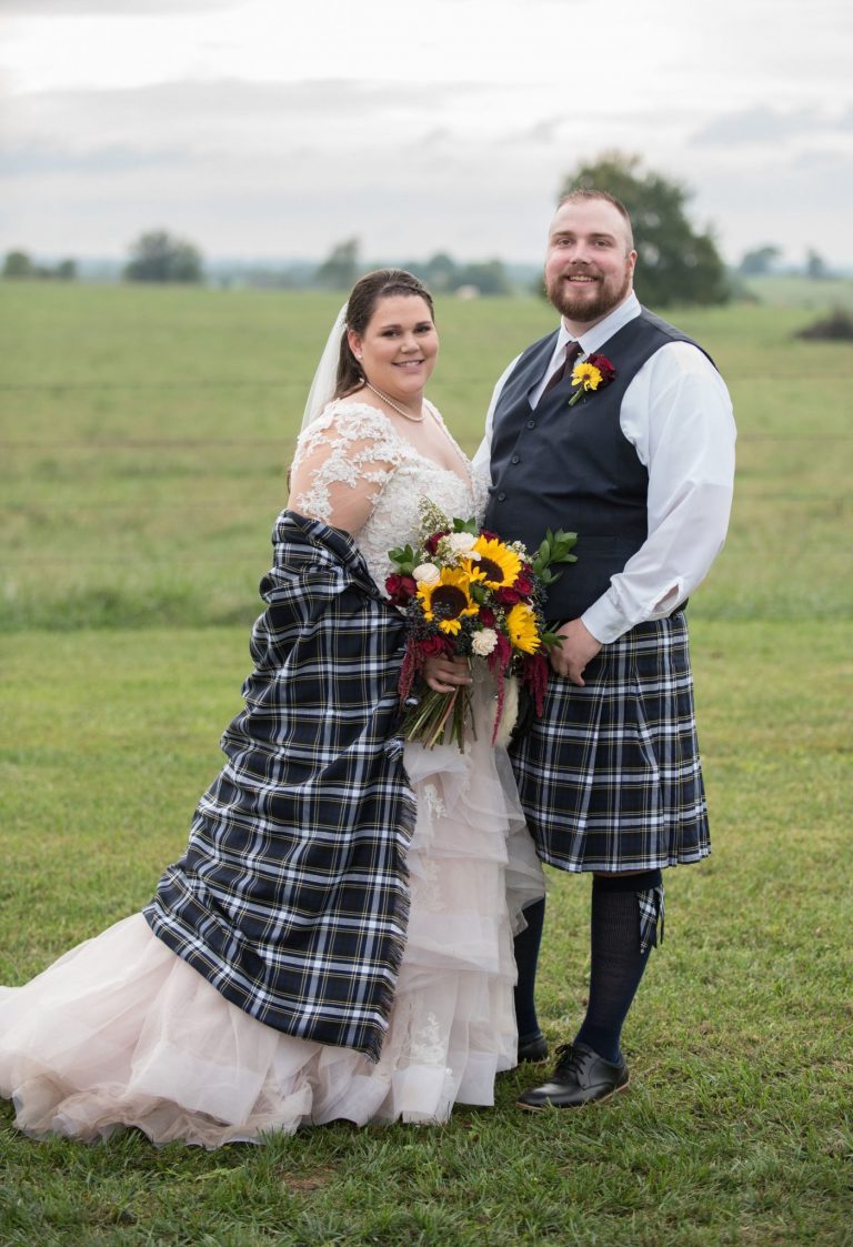 A Norman's bride and her groom in their Scottish tartan.