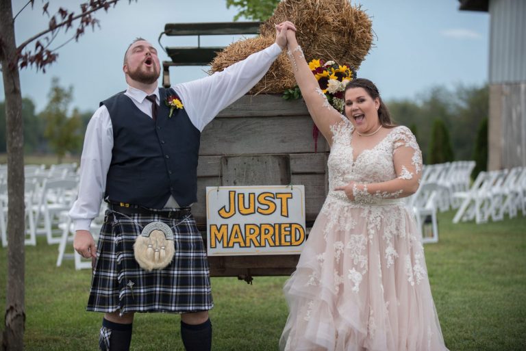 A Norman's bride and her kilt-wearing groom celebrate.