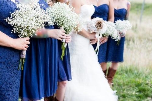 bride and bridesmaid in blue dresses with boots