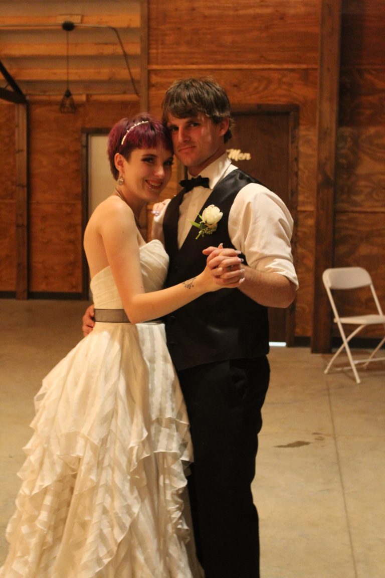 A Norman's bride and her groom share a dance.